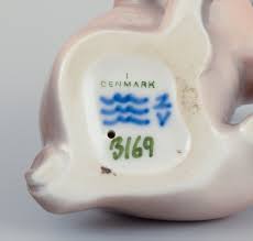 Royal Copenhagen, porcelain figurine of a boxer puppy. – L ...