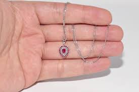 Vintage Circa 1990s 18k Gold Natural Diamond And Ruby Decorated Pendant Necklace For Sale at 1stDibs