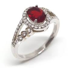 Luxuria | Red ruby colour oval shaped halo dress ring