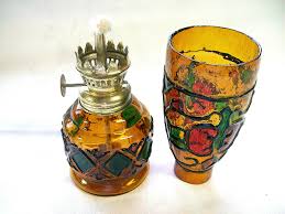 AMBER GLASS WITH RED, GREEN DESIGN OUTLINED IN BLACK OIL ...