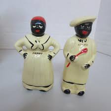 Sold at Auction: 4 PC BLACK AMERICANA PEPPY SALTY SHAKERS
