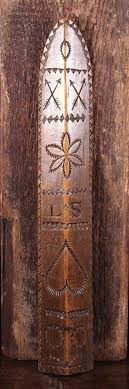 Sold at Auction: An 18th Century Sycamore Love Token Stay Busk. The apexed front carved with a radiant heart, wrythen whorls, a daisy wheel , crossed lover's arrows and initials S.T. below