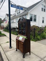 Free antique secretary desk on January walkway
