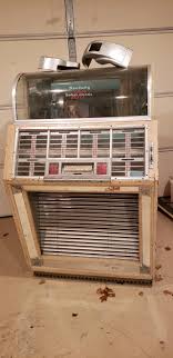 Im selling this 100BL. 700. PM me if ready to buy Description:Plate certified Seeburg 100BL. Needs restoration obviously. 95 percent there. These BL models are real nice with the zebra veneer finish.