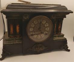 Lot - Antique Seth Thomas, wooden with marbleized decoration.and shaped feet.11 x 16 1/2 x 6 1/4 inches.