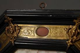 Sold at Auction: Capodimonte porcelain plate with relief "Mythological Scene - Sacrificial Scene with Pan" in octagonal Renaissance style wooden frame with bronze mounting and semi-precious stone medallions, Naples c. 1740/1760, slightly