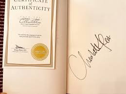 Ric Flair and Charlotte Flair autographed Second Nature hardcover book JSA | AutographsForSale.com