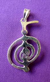 Reiki Cho Ku Rei chakra pendant.