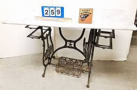 DOMESTIC CAST IRON SEWING MACHINE BASE MARBLE TOP TABLE 28 1/2"H X 41"W X 18"D sold at auction on 20th August | George Cole