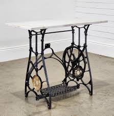 Sold at Auction: Antique 'New Century' cast iron treadle based garden table, painted black & gold with marble top (h:72 x w:90 x d:40cm)