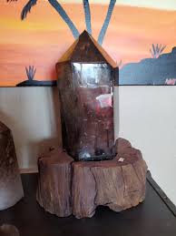 Natural polished Smokey Quartz point on wood stand ...