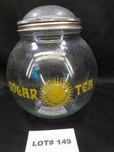 Sold at Auction: Vintage Solar Tea jar with round top lid