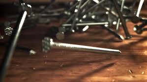 Nails Fall on a Wooden Table Filmed on a Highspeed Camera at ...