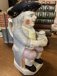 ANTIQUE PASTEL BLUE EYED TOBY JUG WITH PIPE and FLORAL JUG ...