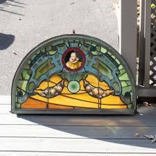 Sold at Auction: Antique stained glass windows depict a landscape with neoclassical temple overlooking a pond with a swan swimming past.