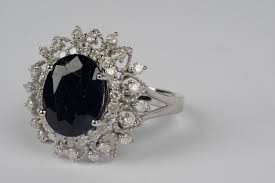 Lot - ORIANNE 14 KARAT WHITE GOLD, DIAMOND, & SAPPHIRE RING