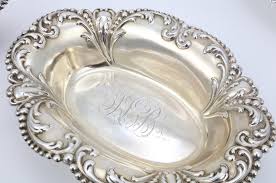 Lot - Three American repousse decorated sterling silver bowls, various makers, 20th century