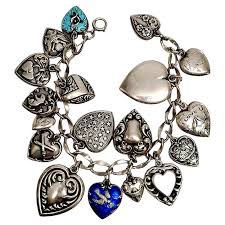 Sterling Silver Loaded Puffy Heart Charm Bracelet at 1stDibs | loaded charm bracelet, sterling silver charm braclet, vintage puffy heart charm bracelet