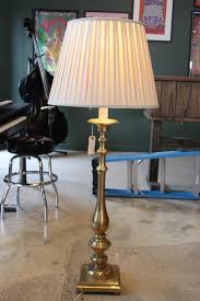 Sold at Auction: TALL BRASS CANDLESTICK FLOOR LAMP