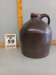 Sold at Auction: Brown Whiskey Jug w/handle