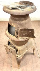 Sold at Auction: Cast Iron Footed Pot Belly Wood Firing Stove