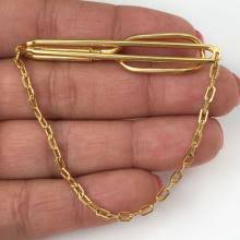 Sold at Auction: SWANK: Vintage gold tone tie clip, signed