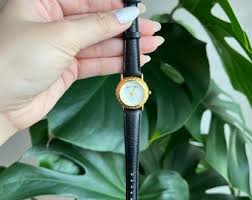 Vintage Infinity Women's Watch: Gold Tone, Black Leather ...