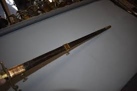 Sold at Auction: A NAVAL OFFICER'S FIVE BALL HILTED SPADROON,