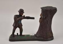 Sold at Auction: J.E. Stevens Cast Iron Mechanical Bank, Circa 1910, "Teddy and The Bear", 9 1/2"h (working condition)