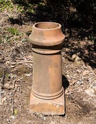 Sold at Auction: Terracotta Chimney Pot with Wrought Iron Sundial
