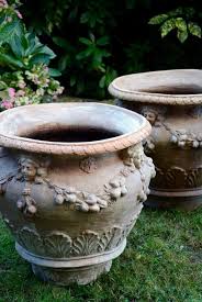 Sold at Auction: Pair of large terracotta planters in domed ...