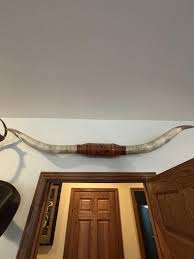 Longhorns wrapped in hand tooled leather | Hunter's Auction Service
