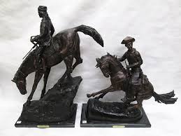 Lot - TWO PATINATED BRONZE SCULPTURES after Remington de