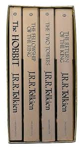 The Hobbit, The Fellowship of the Ring, The Two Towers, and The Return of the King: Set of Four 1975 Paperbacks in a Gold Slipcase by Tolkien, J. R. R.: Near Fine