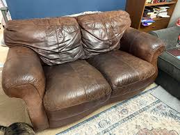 Leather Loveseat, Chair, And Ottoman