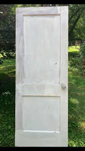 1920's two panel solid wood interior door. Door measures 80”x30” and has the original brass door knob. In great solid condition. Local pick up only, pet & smoke free, cash only. Message