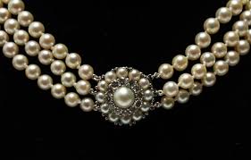 Sold at Auction: 14K Gold Diamond Clasp Three Strand Pearl Necklace