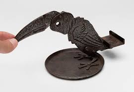 Sold at Auction: HUGO BERGER (Germany, early 20th century). "Toucan". Cigar cutter. Chiseled iron. Without signature. It shows wear.