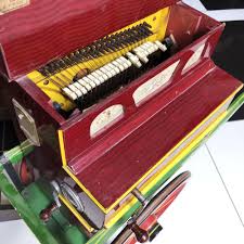 Sold at Auction: Faventia barrel piano with a cart