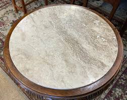 Sold at Auction: Round Marble-Top Table with 3 Carved Nude Ladies.