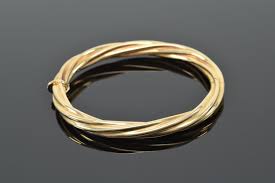 Lot - 14K gold twist bangle bracelet. Marked "RCV Italy