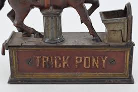 Lot - Late 19th century "Trick Pony" mechanical cast iron bank. Horse head bobs to drop coin. Red and