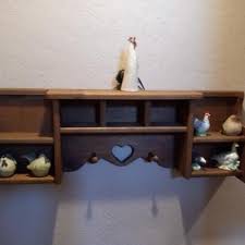 LOT 25 NEW ROYAL ANTIQUE TREADLE SEWING MACHINE IN CABINET | EstateSales.org