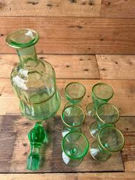 Sold at Auction: Vintage Green Glass Decanter Set With Gold Accents - Elegant And Unique Collection