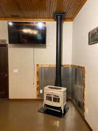 Here are some pictures of a recent install for a customer. The stove is a Vermont Castings Encore. We installed double wall stove pipe from woodstove up to the ceiling and double