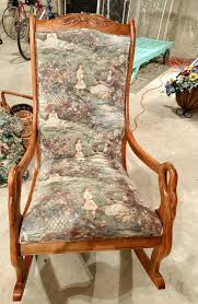 Wood swan armed rocking chair with toile upholstery | EstateSales.org