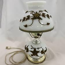 53. Electric Milk Glass and Bronze Flower GWTW Lamp | EstateSales.org