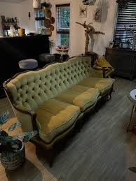 This couch from 1909 that my friend bought, I don't know the ...