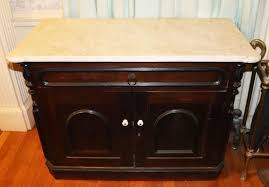 Victorian Walnut Cabinet with Scalloped Marble Top | Kaminski Auctions