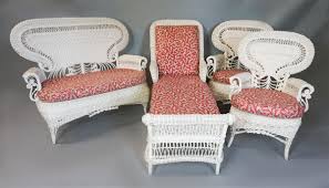 Lot - FOUR-PIECE SUITE OF VICTORIAN STYLE WHITE WICKER PATIO FURNITURE